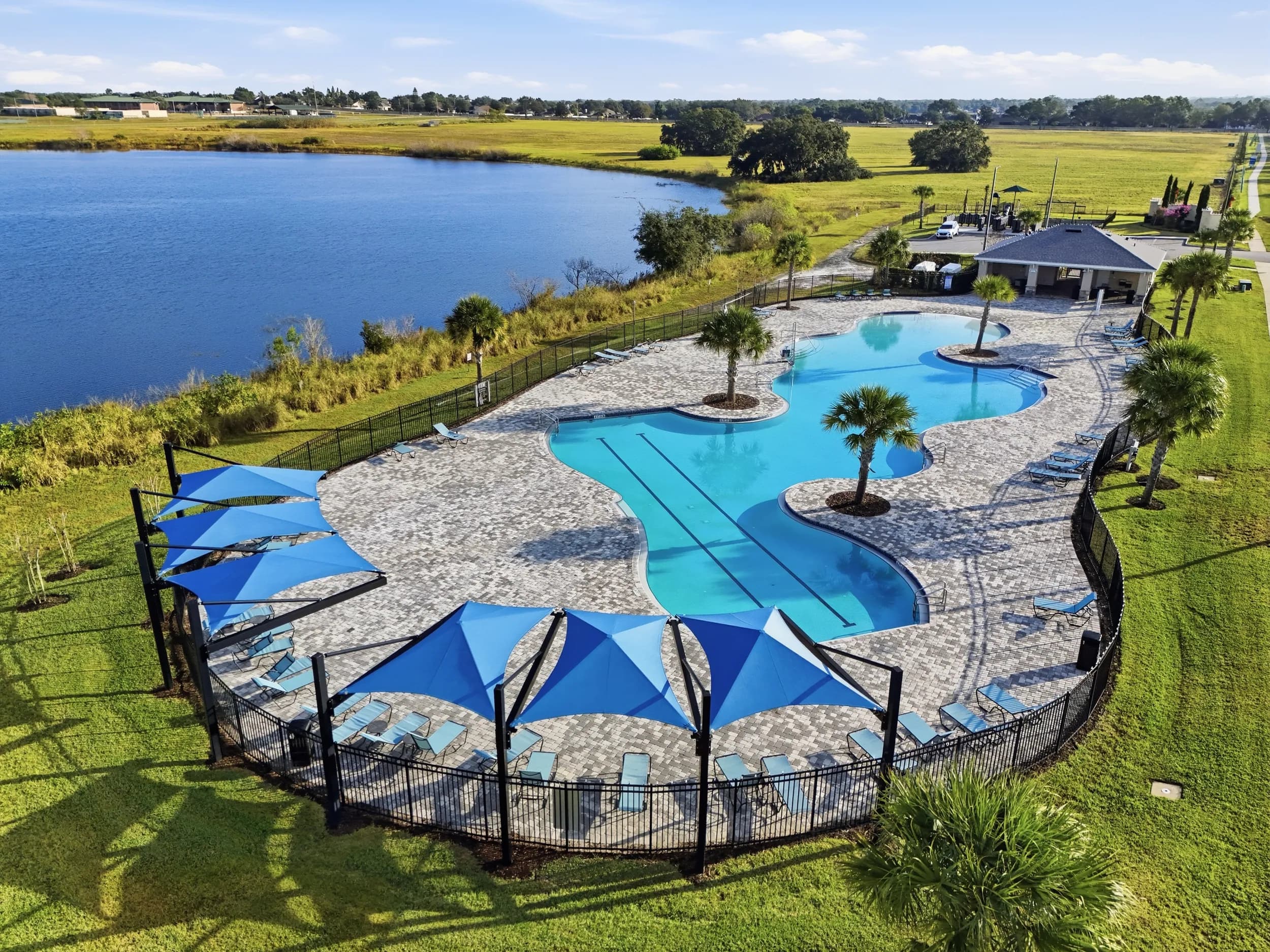 Aerial of the Villa Mar resort pool and cabanas beside the lake, Winter Haven