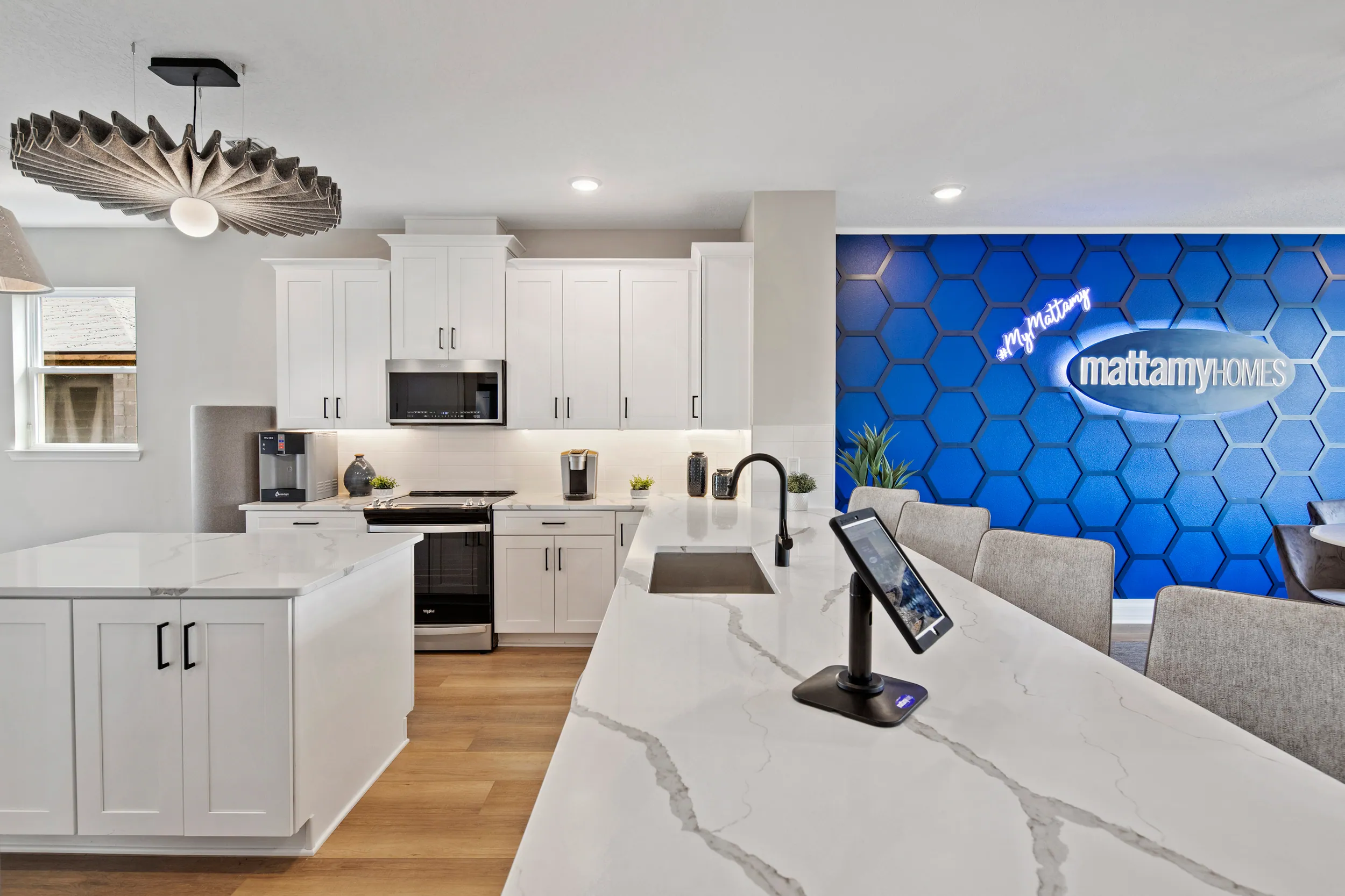 Newbury model kitchen with the Mattamy Homes feature wall at Meridian Parks