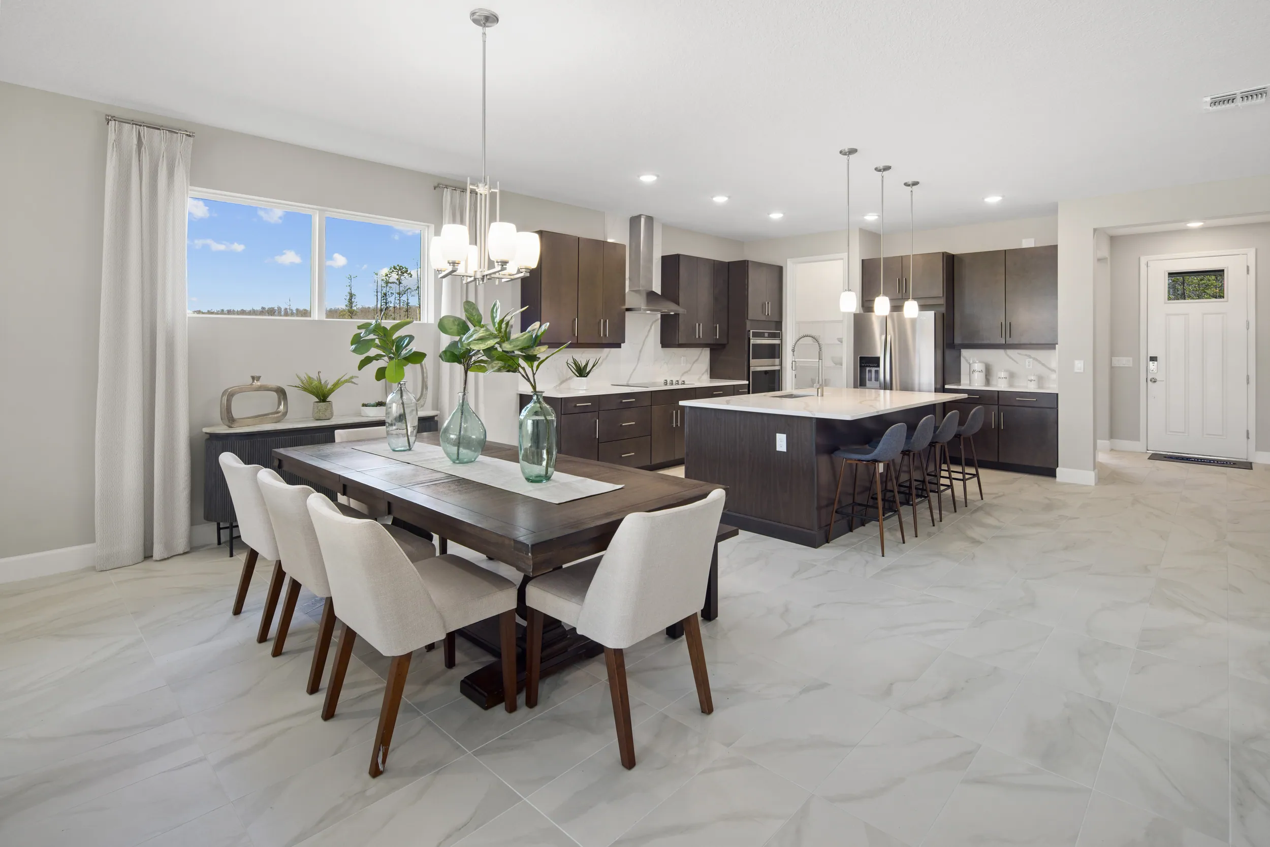 Olympic model dining room and dark kitchen at Meridian Parks