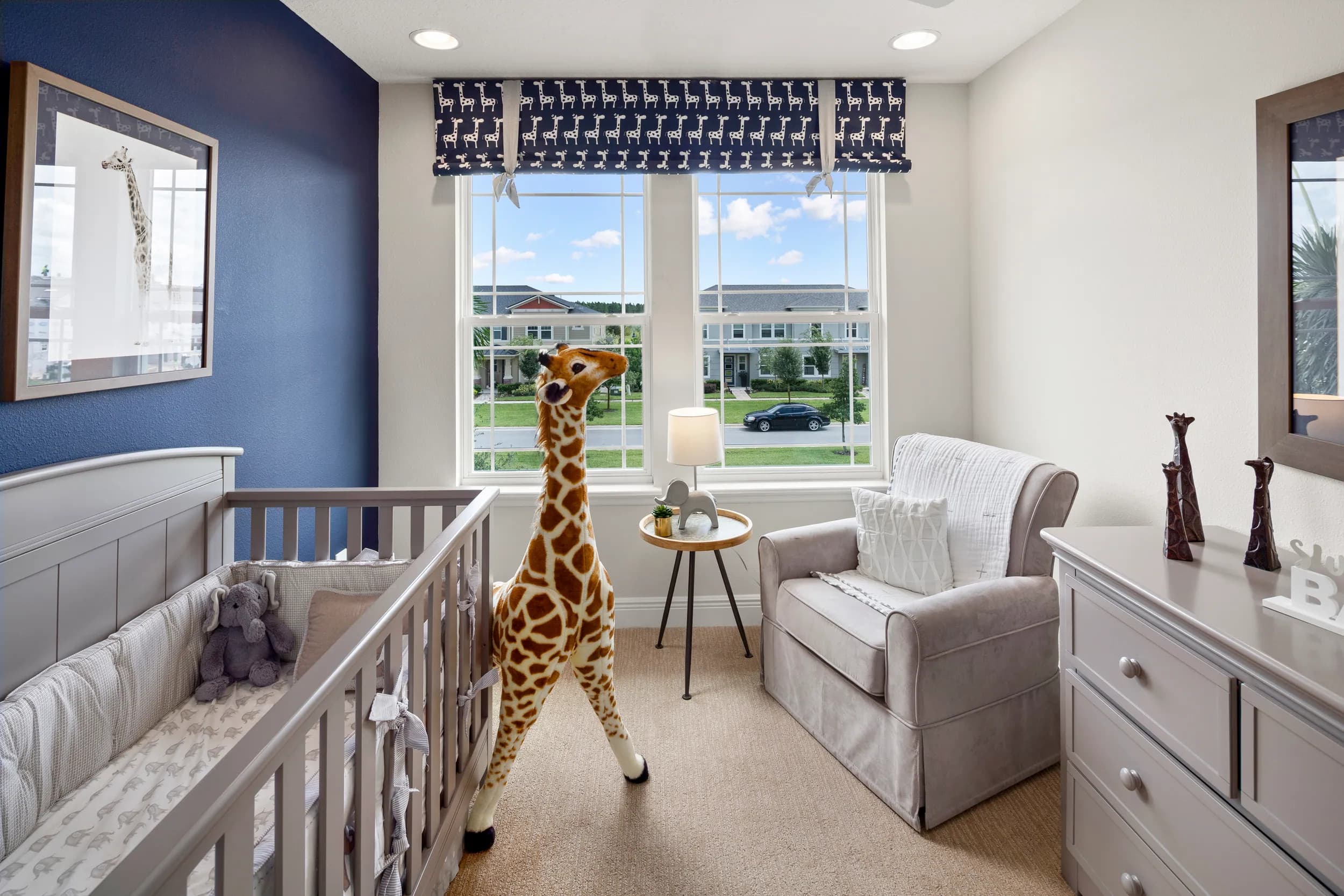 Hawksmoor model nursery with navy walls and a giraffe