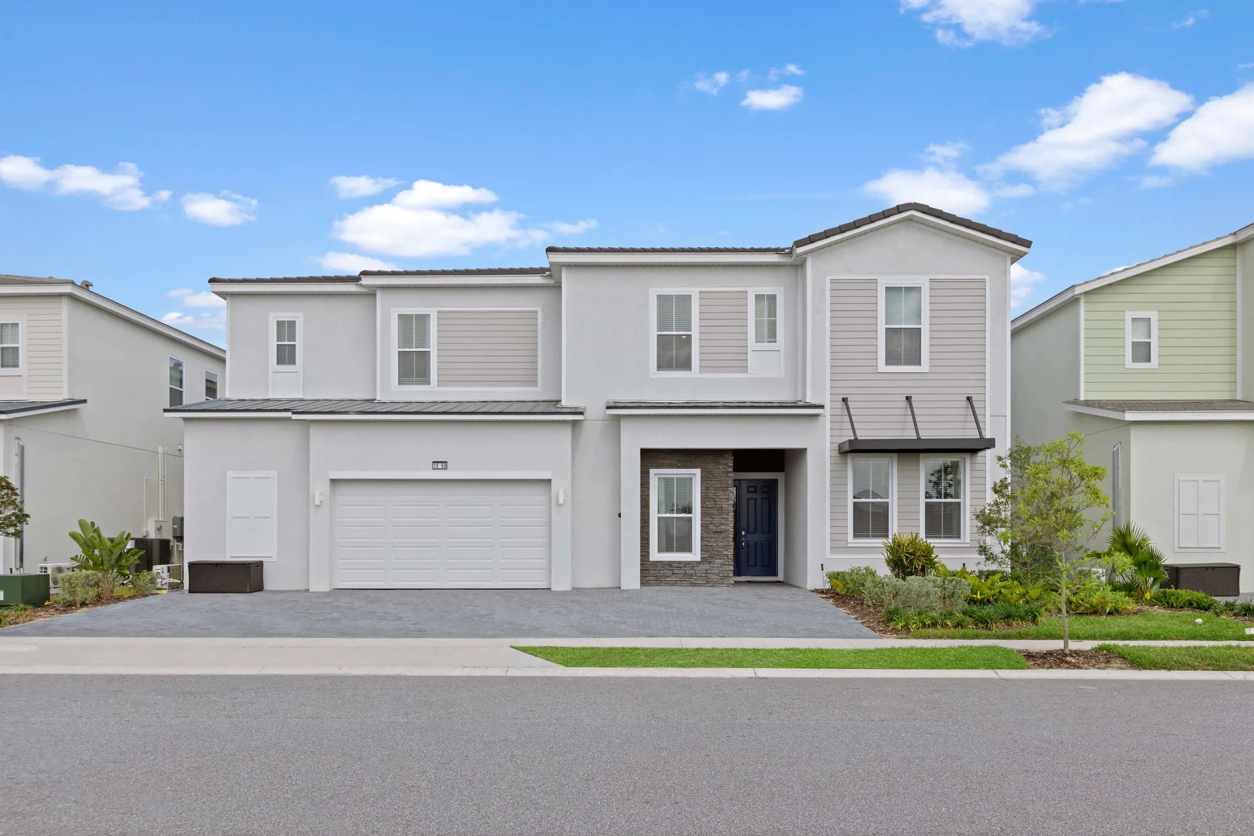 Vacation townhome exterior with paver drive