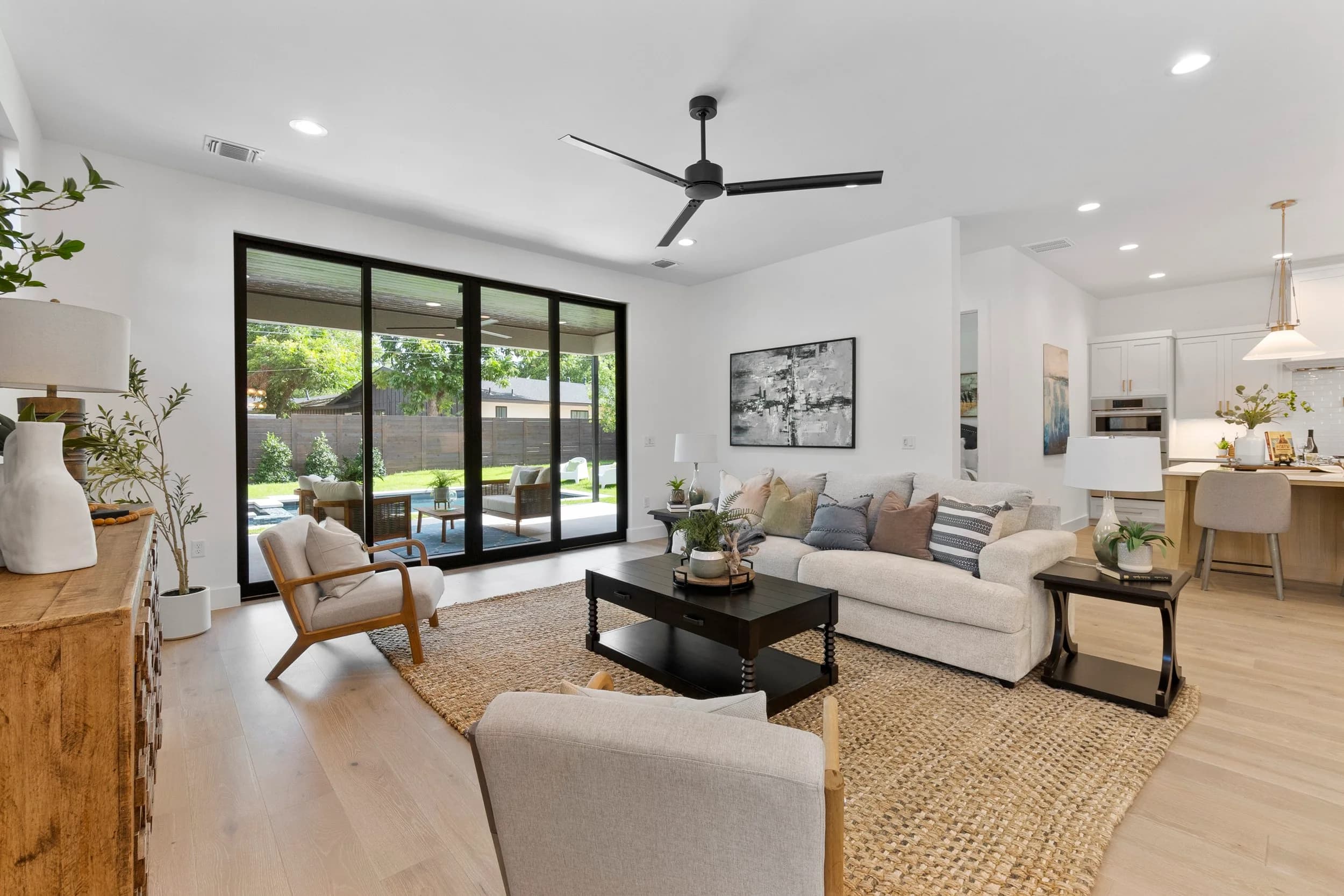 New-build living room in Austin with glass doors to the yard