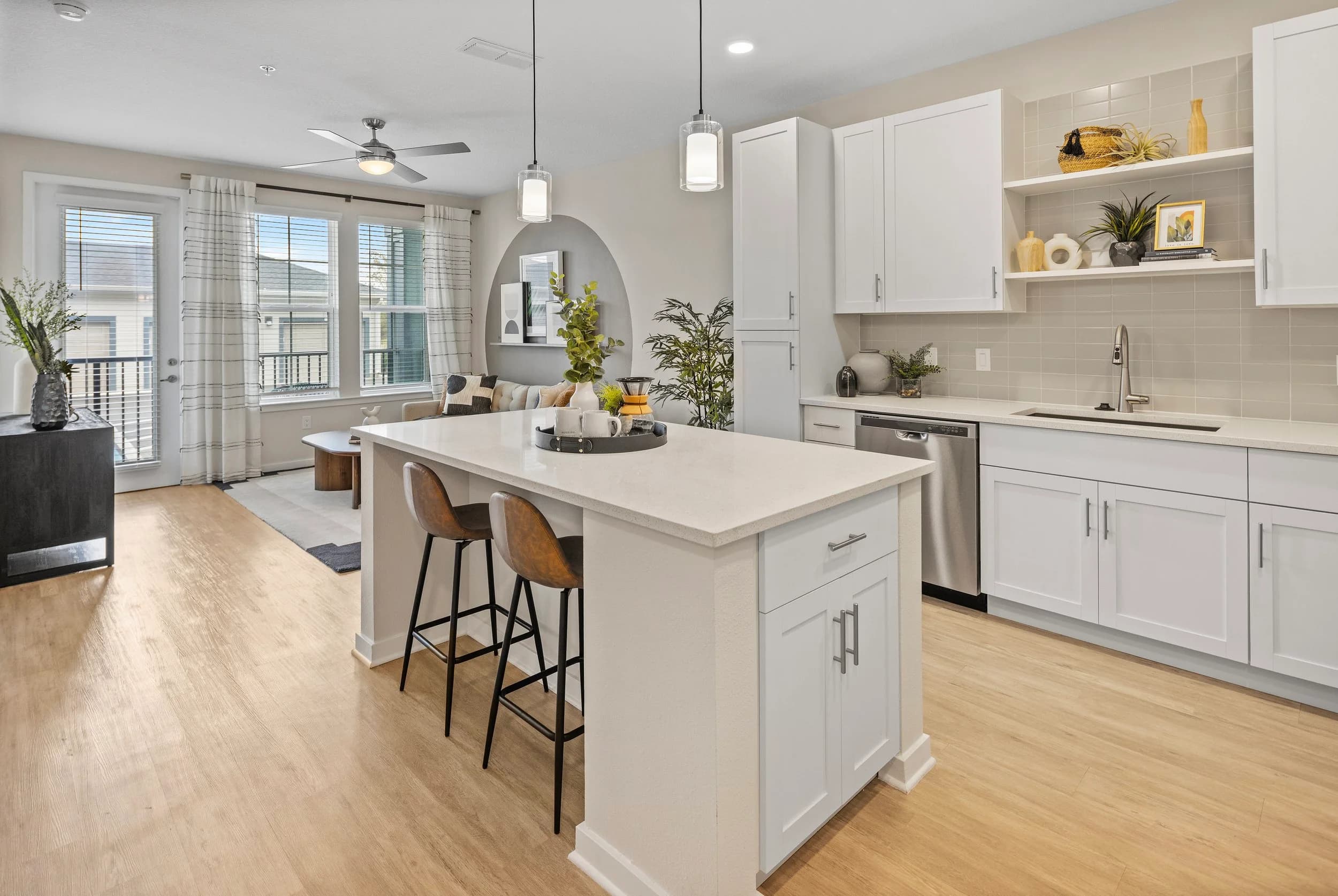 Model apartment kitchen with island seating