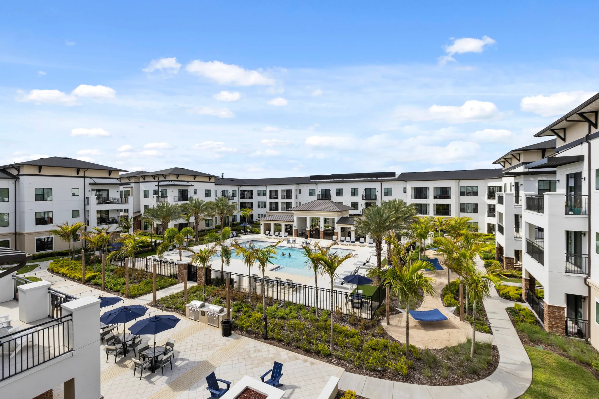 Community flyover of an apartment courtyard and pool