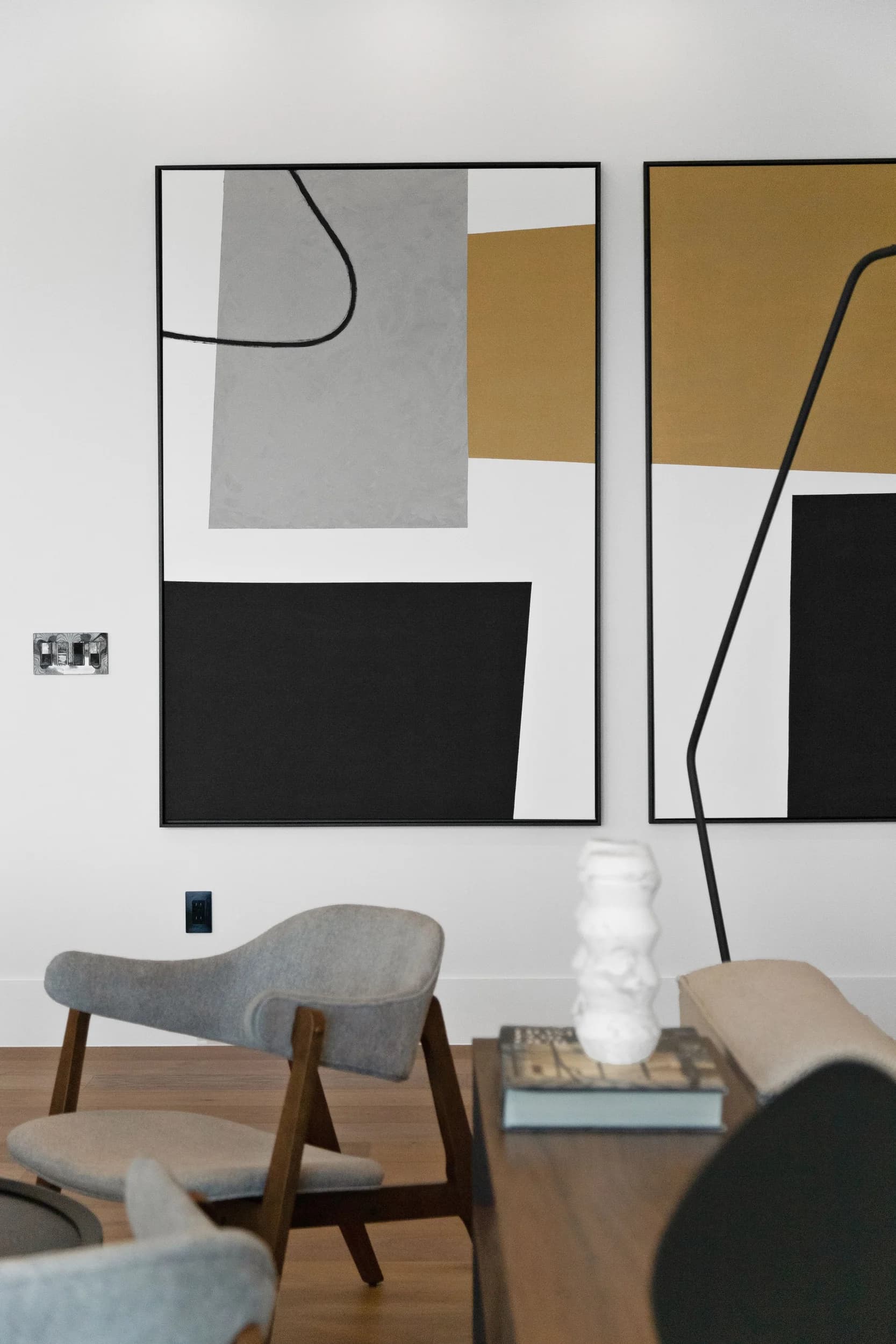 Abstract art detail above a console table