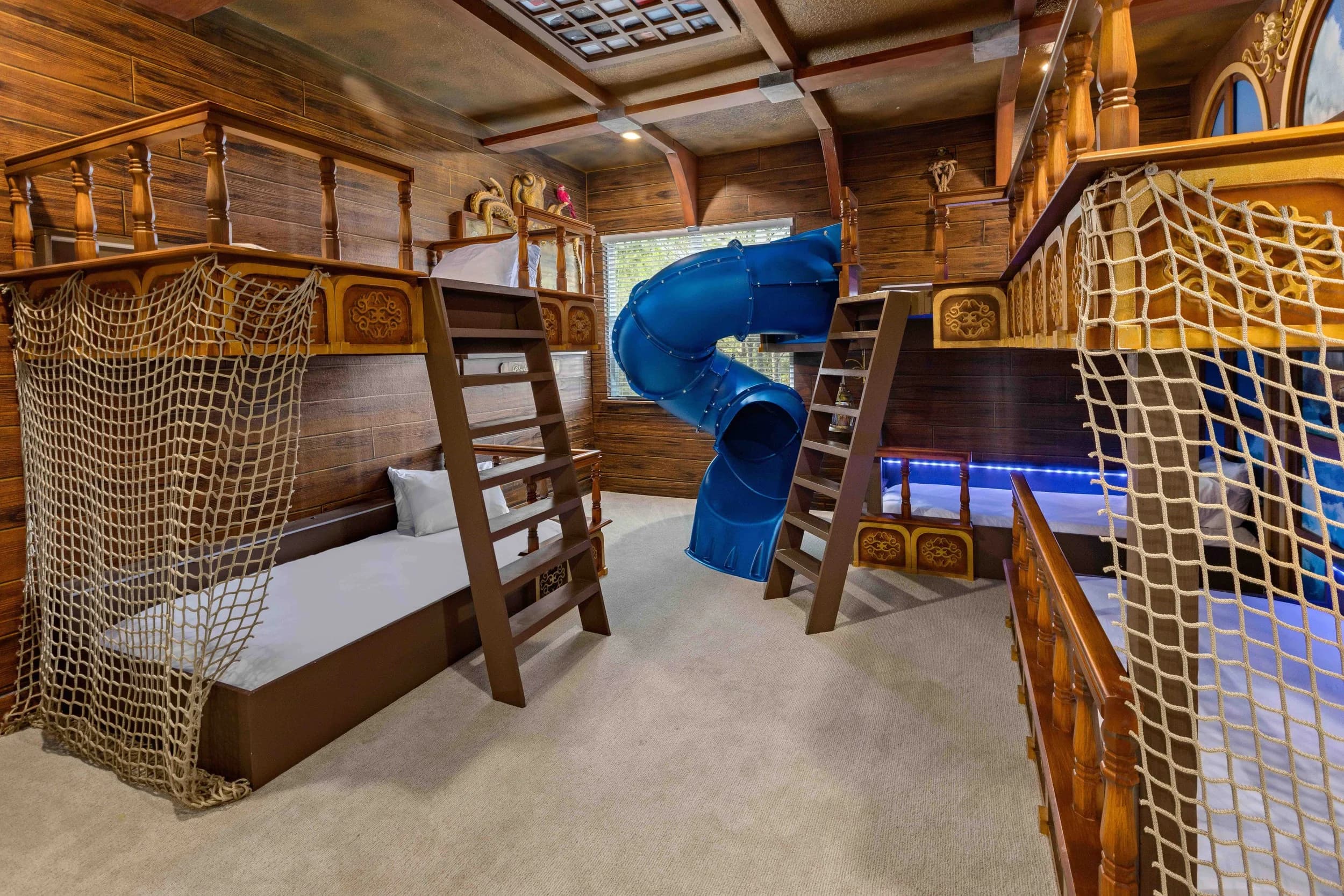 Treehouse-themed bunk room with slide