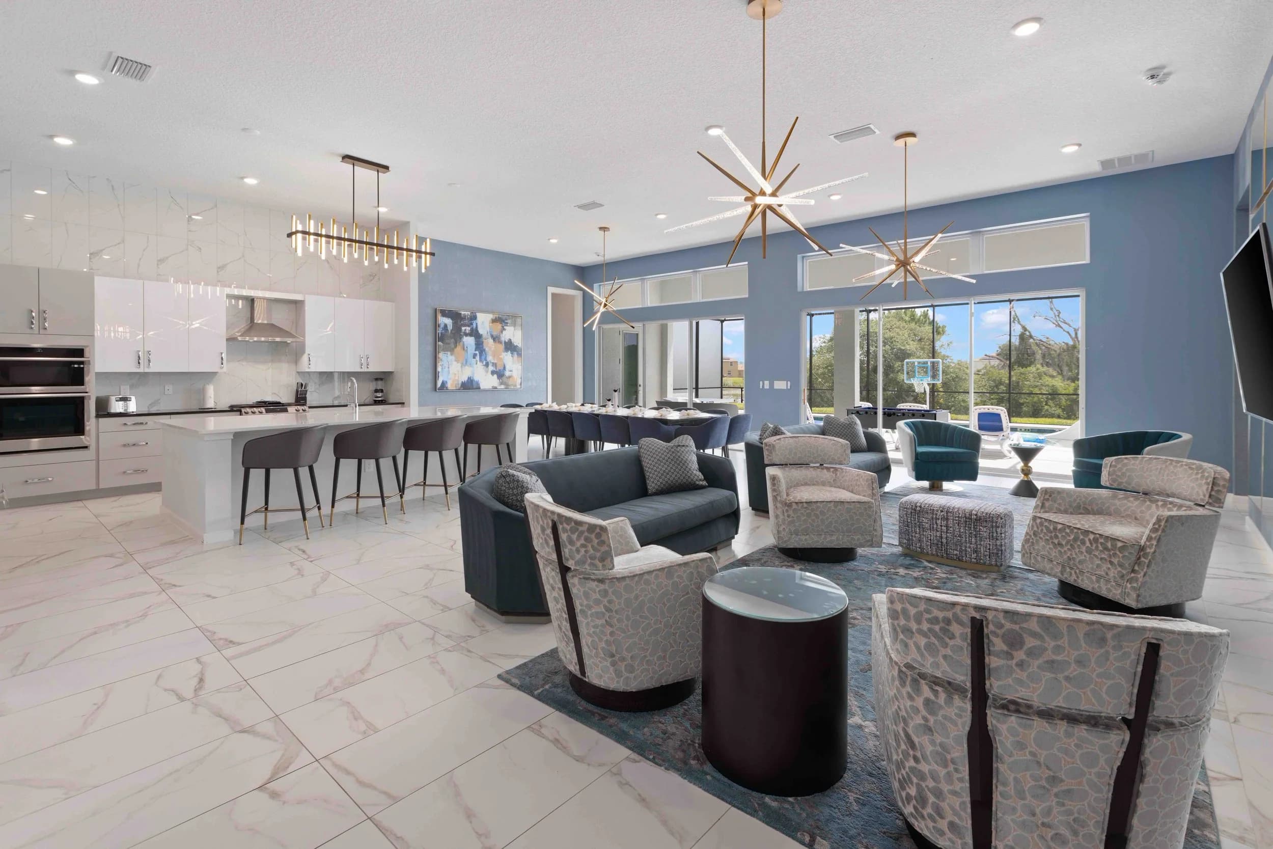 Great room with sofas, dining, and kitchen