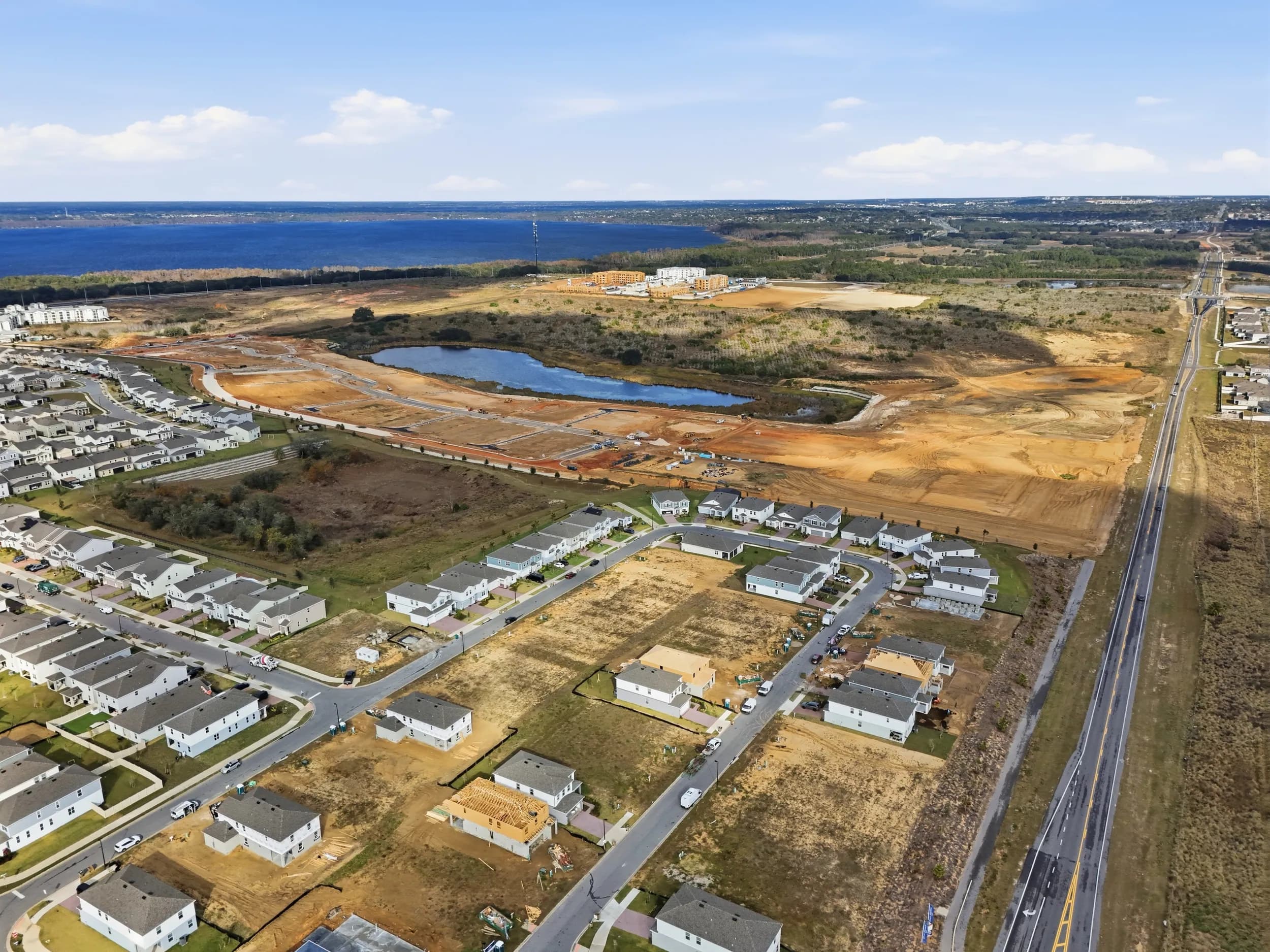 Aerial over Olympus: graded lots, retention ponds and the first streets