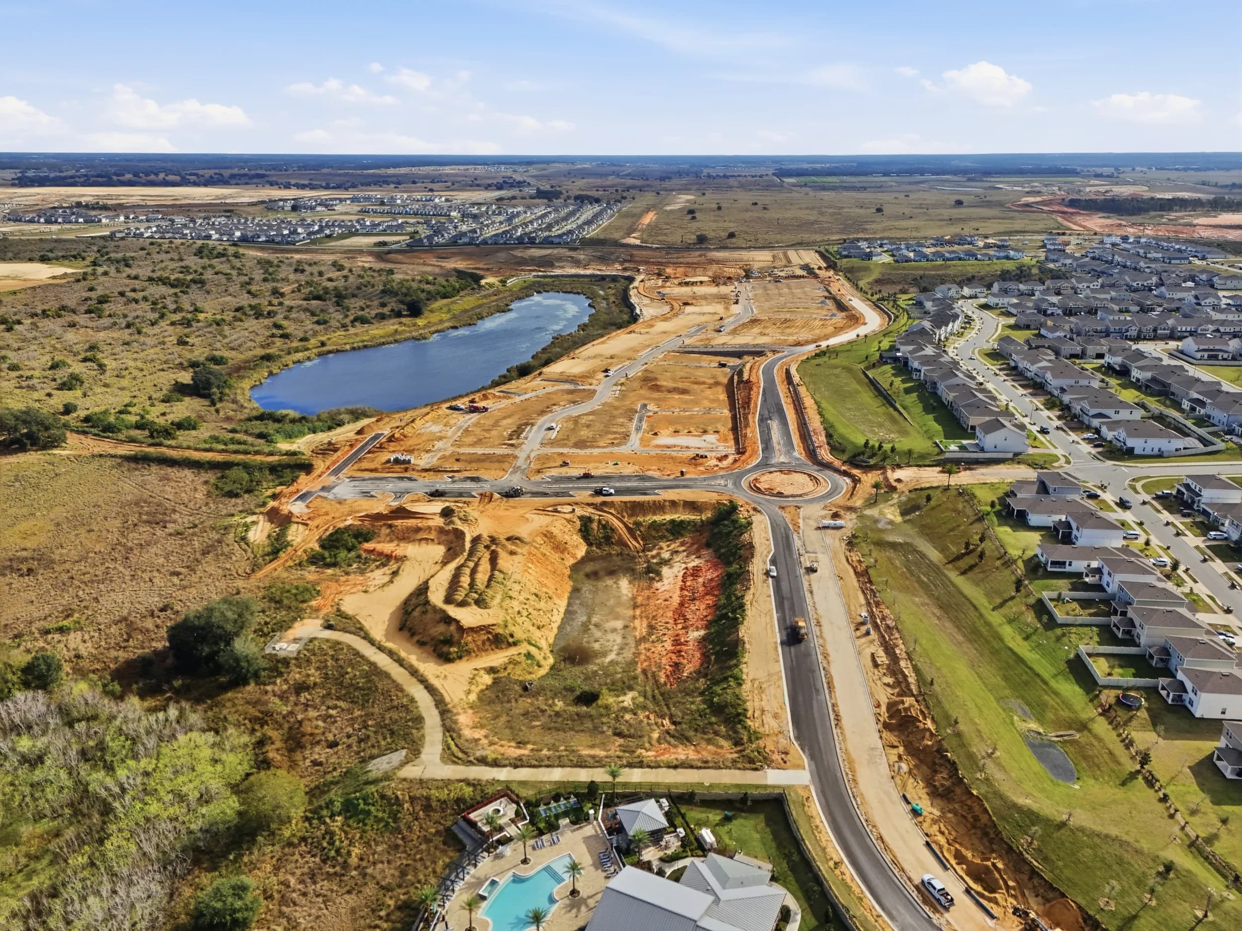 Cleared phase with new roads and a pond beside completed streets