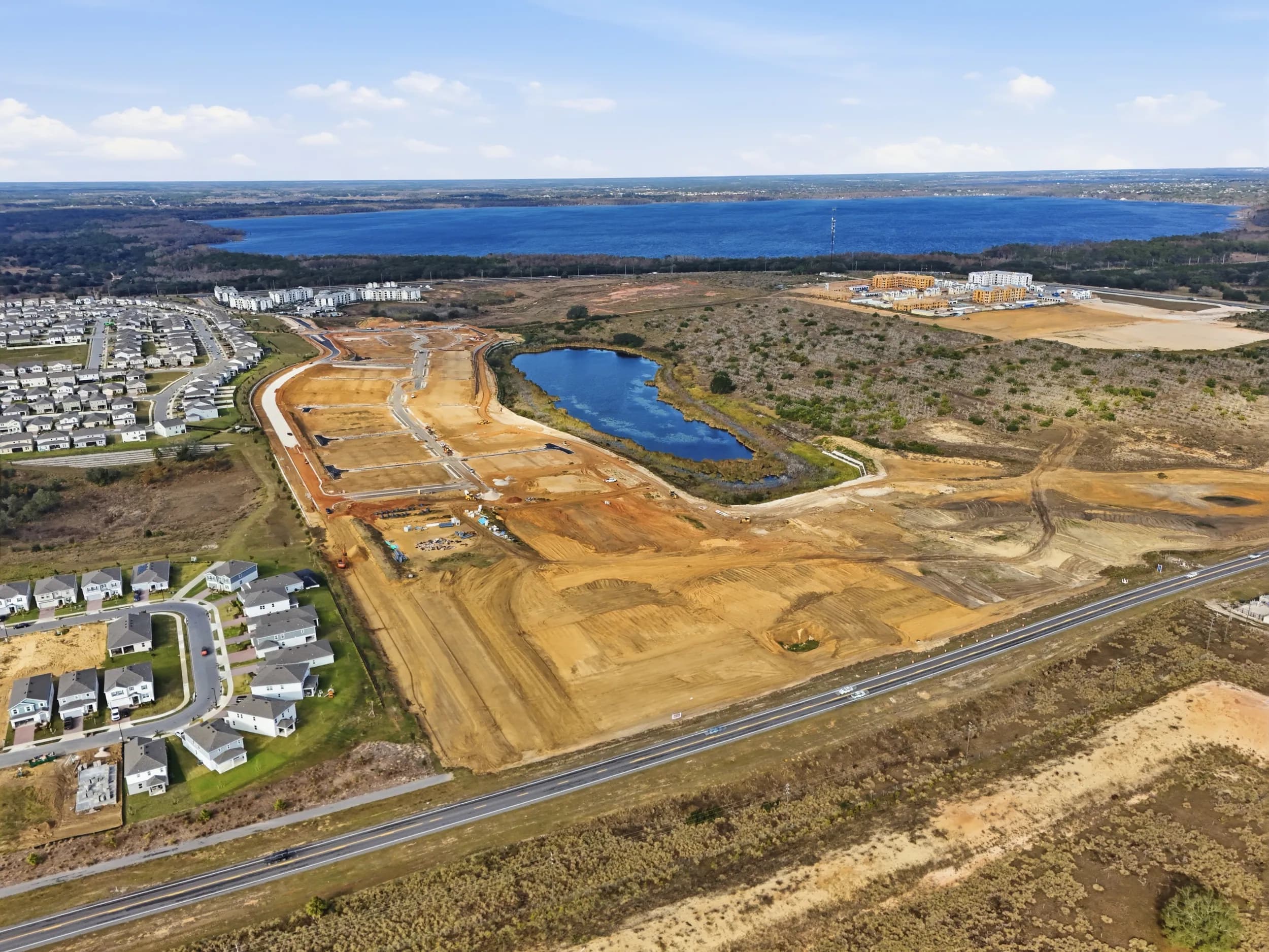 New phase graded beside the lake as homes go vertical