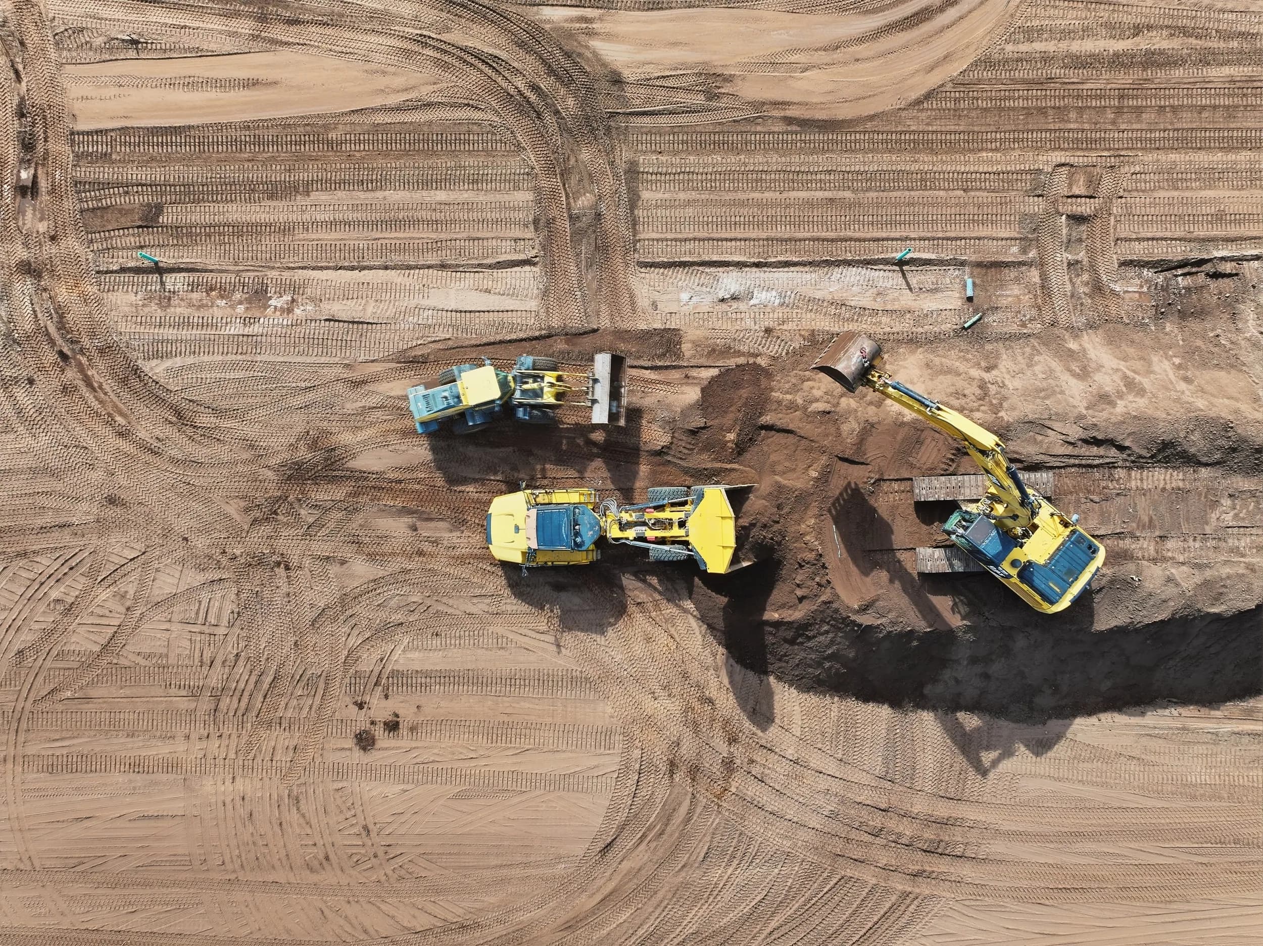 Top-down of excavators grading a new section