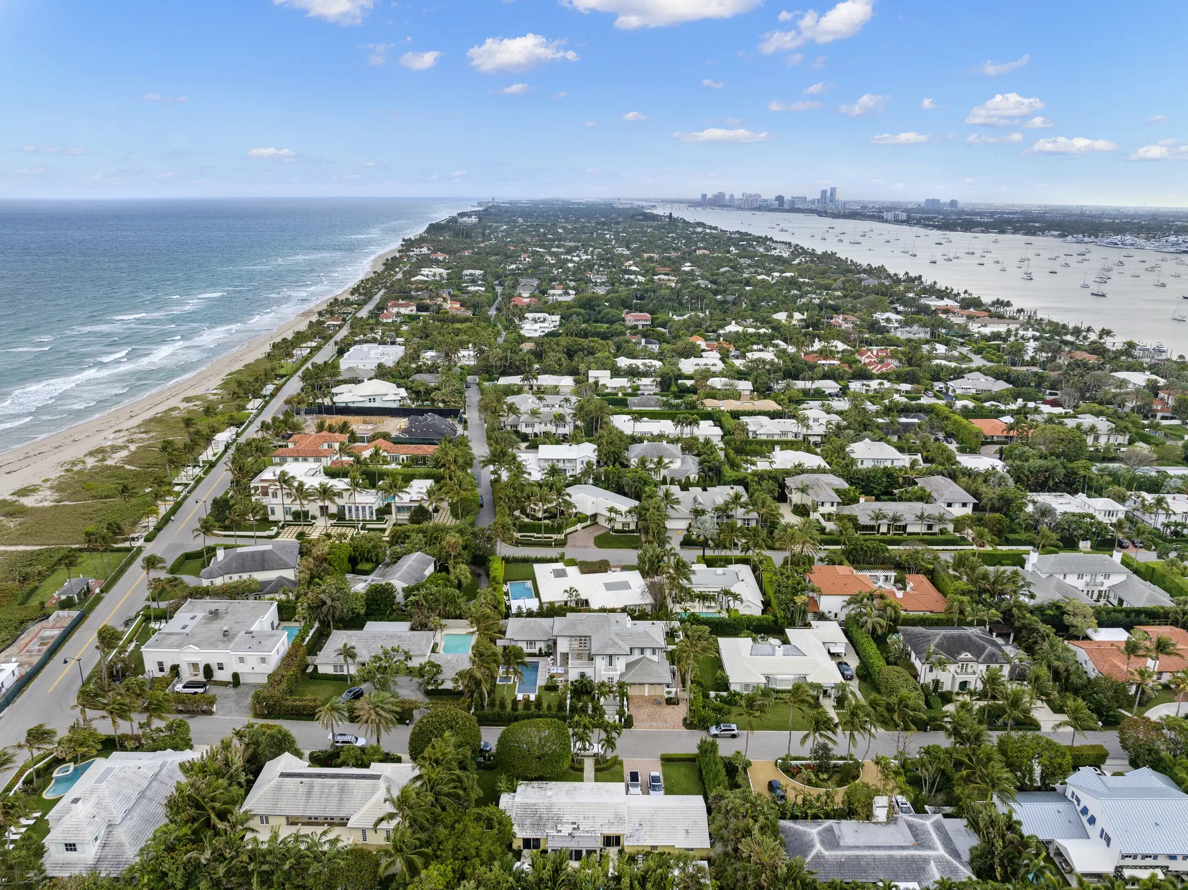 High aerial down the length of Palm Beach island between the ocean and Lake Worth