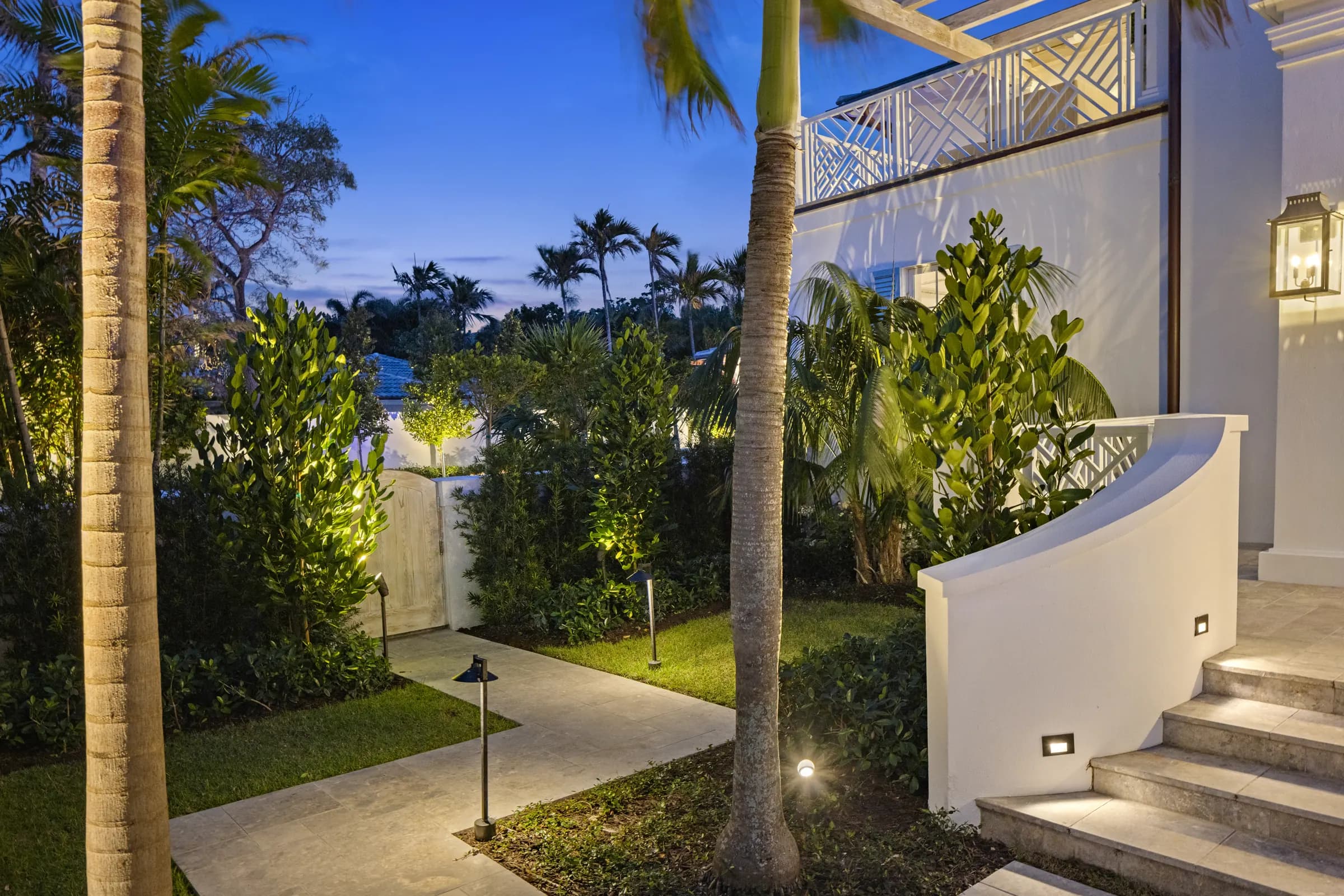 Side entry stairs and garden lighting at dusk