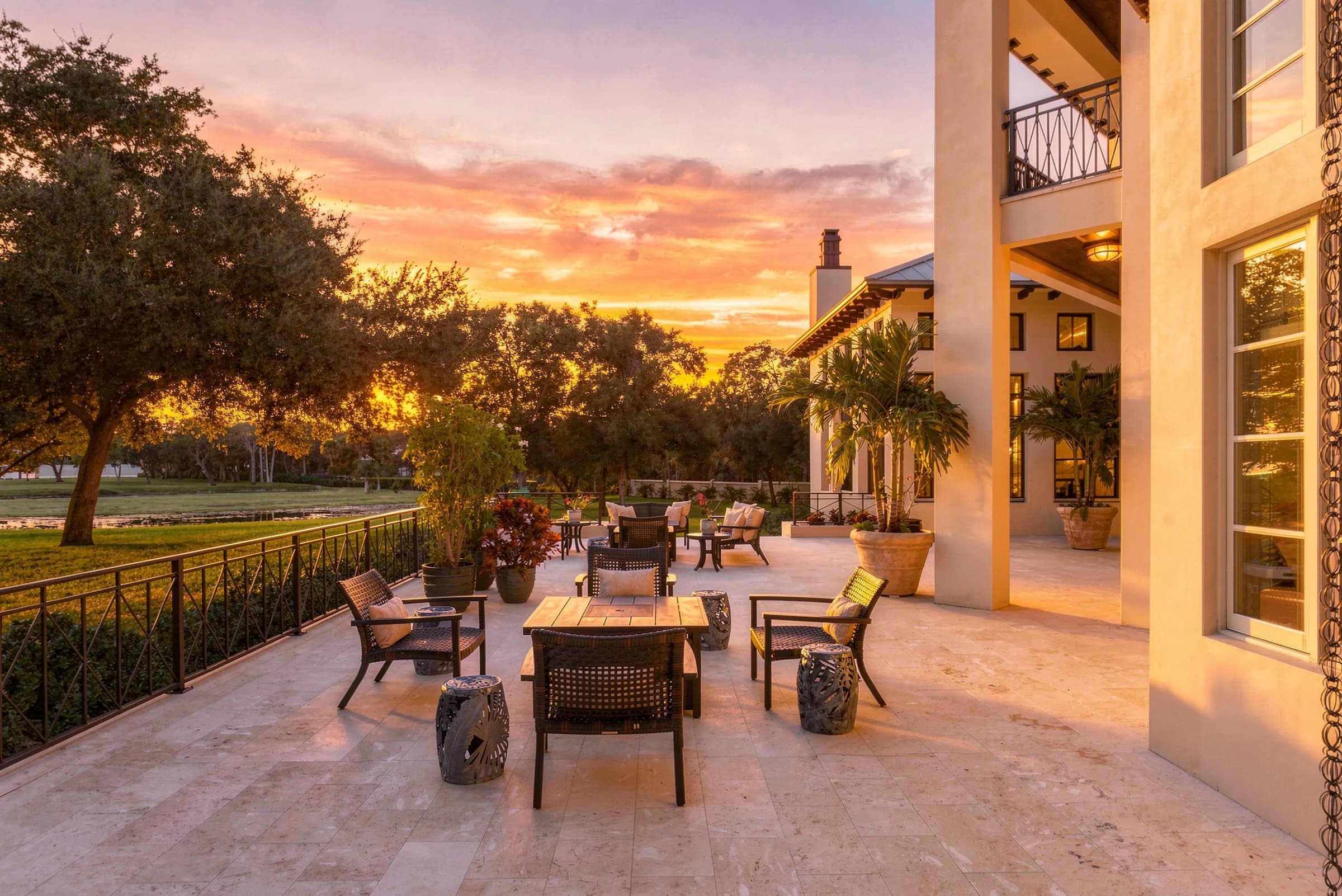 Limestone terrace and the two-story rear elevation at golden hour