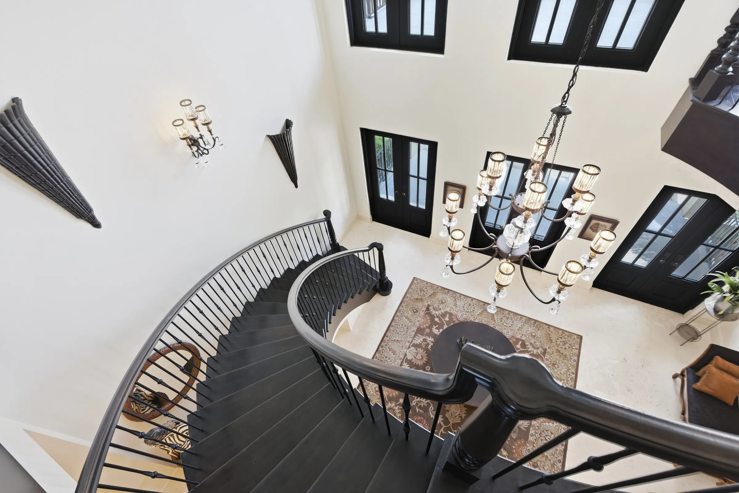 The curved staircase seen from the landing above