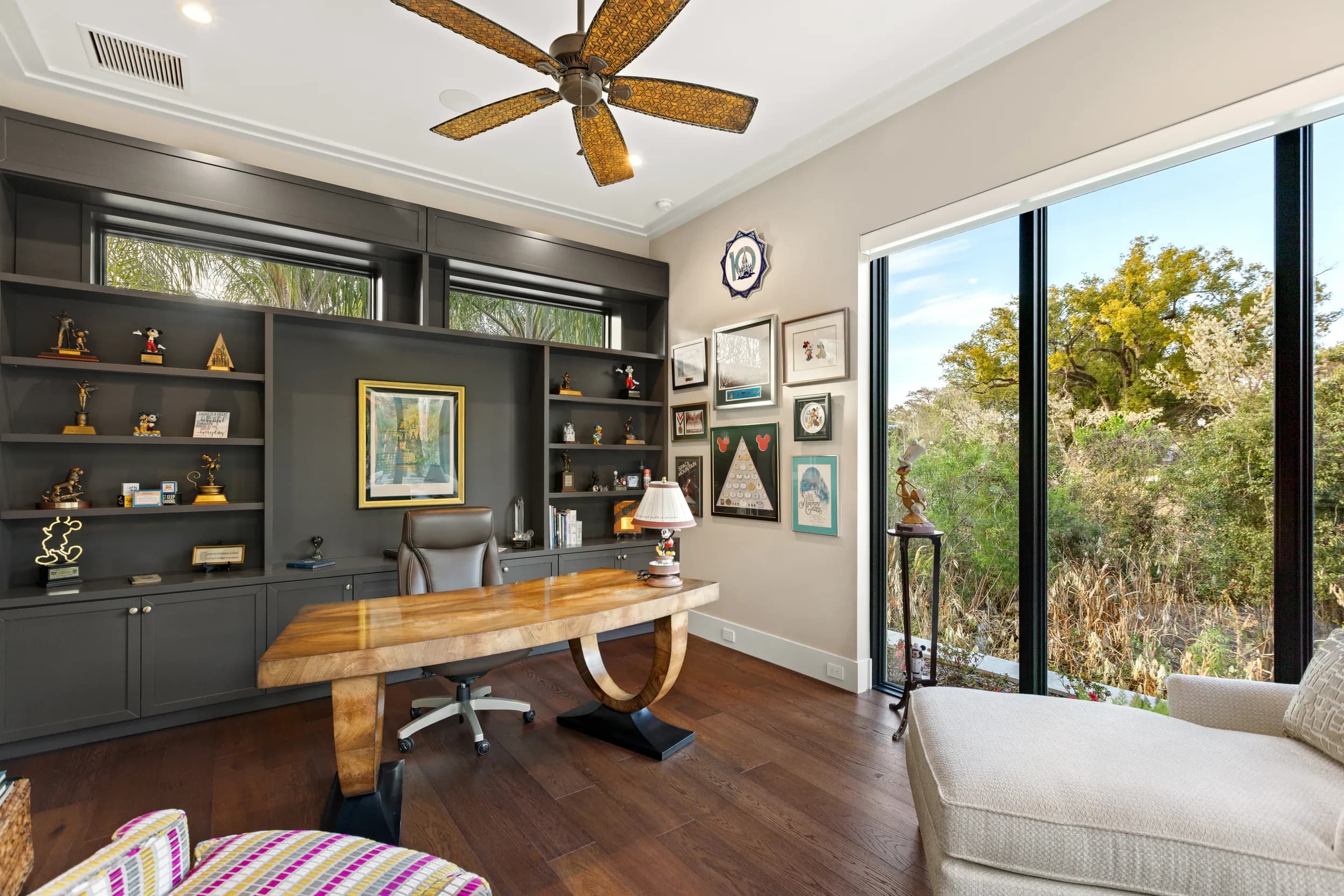Home office with charcoal built-ins and a live-edge desk facing the garden